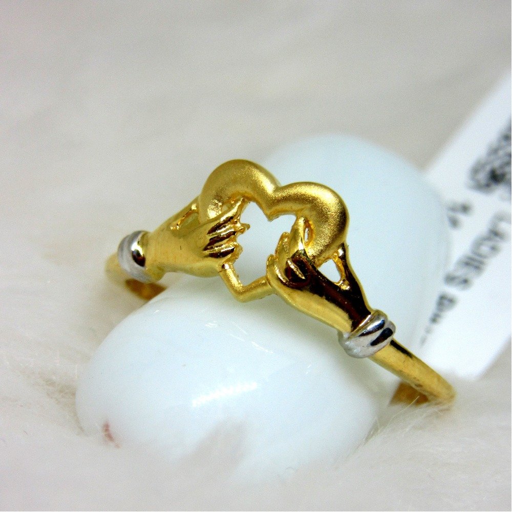 Gold heart with handpair ring